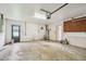Spacious garage featuring a water heater, pegboard, and access door for convenience at 1972 Lansing Dr, Clearwater, FL 33763