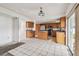 Bright kitchen featuring wood cabinets, stainless steel appliances, tile flooring, and a center island at 1972 Lansing Dr, Clearwater, FL 33763