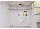 Laundry room area featuring white walls and tile flooring at 1972 Lansing Dr, Clearwater, FL 33763