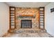 Living room with stone fireplace and built-in shelves, creating a cozy and inviting atmosphere at 1972 Lansing Dr, Clearwater, FL 33763