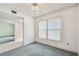 View of a living room with a window and access to the next room at 1972 Lansing Dr, Clearwater, FL 33763