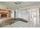 Empty living room featuring a stone fireplace, adjacent to the front door at 1972 Lansing Dr, Clearwater, FL 33763