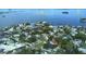 Aerial view showcasing property, nearby community, Dunedin Causeway and Honeymoon Island in the distance at 201 South St, Palm Harbor, FL 34683