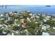 Stunning aerial view of a waterfront neighborhood with lush greenery and beautiful homes near a bridge at 201 South St, Palm Harbor, FL 34683