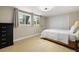 Cozy bedroom with hardwood floors, neutral walls, and an abundance of natural light at 201 South St, Palm Harbor, FL 34683