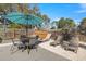 Inviting outdoor patio with dining area, sun loungers, perimeter fence, and comfortable seating at 201 South St, Palm Harbor, FL 34683