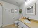 Well-lit bathroom featuring a modern vanity with decorative fixtures and tiled floor at 2119 Broadway View Ave, Brandon, FL 33510