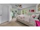 Bright bedroom with neutral carpet, ceiling fan and an abundance of natural light at 2119 Broadway View Ave, Brandon, FL 33510