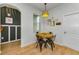 Cozy dining area offering a view to the main hall and stylish pendant lighting at 2119 Broadway View Ave, Brandon, FL 33510