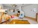 Cozy living room with open floor plan features a ceiling fan and access to the kitchen at 2119 Broadway View Ave, Brandon, FL 33510