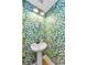 Charming powder room with floral wallpaper, a pedestal sink, and stylish lighting at 2119 Broadway View Ave, Brandon, FL 33510