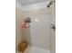 Clean and simple tiled shower with a small wooden bench for convenience at 2119 Broadway View Ave, Brandon, FL 33510