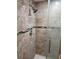Remodeled tiled shower with modern fixtures and glass door at 2209 Belleair Rd # C3, Clearwater, FL 33764