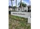 Chateau Belleair community sign with lush landscaping and condominium buildings in the background at 2209 Belleair Rd # C3, Clearwater, FL 33764