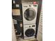 Laundry closet featuring stacked washer and dryer, and HVAC unit at 2209 Belleair Rd # C3, Clearwater, FL 33764