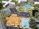 A high angle shot of community amenities with tennis courts, swimming pool, and clubhouse at 2222 Norwegian Dr # 16, Clearwater, FL 33763