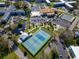 An aerial view showcasing community amenities including tennis, pickle ball, and an outdoor pool at 2222 Norwegian Dr # 16, Clearwater, FL 33763