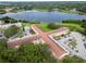 Expansive lakefront views from this condominium complex with mature trees and lush green landscaping at 2222 Norwegian Dr # 16, Clearwater, FL 33763