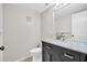 Updated bathroom featuring a vanity with marble countertop and modern fixtures at 2222 Norwegian Dr # 16, Clearwater, FL 33763