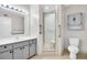 Bathroom featuring a vanity with a sink, a glass door shower, and a toilet at 2222 Norwegian Dr # 16, Clearwater, FL 33763