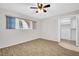 Well-lit bedroom featuring modern floors, neutral colors, and large closet space at 2222 Norwegian Dr # 16, Clearwater, FL 33763