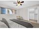 Cozy bedroom with neutral chair, window views, and walk-in closet for ample storage at 2222 Norwegian Dr # 16, Clearwater, FL 33763