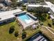 Large community pool for residents with covered pavilion, sun loungers, and lots of room for relaxing at 2222 Norwegian Dr # 16, Clearwater, FL 33763