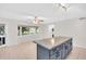 Bright kitchen features large island and is open to a dining area with a bay window with backyard view at 2222 Norwegian Dr # 16, Clearwater, FL 33763