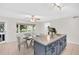 Kitchen features large island with drawers, and is open to dining area with natural light from the bay window at 2222 Norwegian Dr # 16, Clearwater, FL 33763