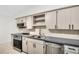 Well-lit kitchen boasts stainless steel appliances, sleek countertops, and ample cabinet space at 2222 Norwegian Dr # 16, Clearwater, FL 33763