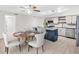 Spacious kitchen includes a dining area, stainless steel appliances, and ample natural light at 2222 Norwegian Dr # 16, Clearwater, FL 33763