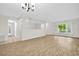 Open floor plan featuring spacious living room and large window at 2222 Norwegian Dr # 16, Clearwater, FL 33763