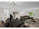 Bright living room featuring an open floor plan, dining area, and neutral decor at 2222 Norwegian Dr # 16, Clearwater, FL 33763