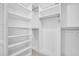 Organized walk-in closet featuring shelving and ample storage space at 2222 Norwegian Dr # 16, Clearwater, FL 33763