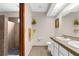 Well-lit bathroom featuring a double vanity, tile flooring, and a step-in shower at 2319 Canfield Dr, Spring Hill, FL 34609