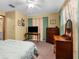 Cozy bedroom with neutral wall-to-wall carpet, a ceiling fan, and a closet at 2319 Canfield Dr, Spring Hill, FL 34609