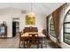 Dining room with natural light, tile flooring, and traditional furnishings with backyard views at 2319 Canfield Dr, Spring Hill, FL 34609