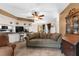 Spacious living room adjacent to the kitchen and dining area, featuring a comfortable sofa at 2319 Canfield Dr, Spring Hill, FL 34609
