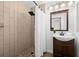 Updated bathroom with tiled shower, modern vanity, and neutral color scheme at 2353 Eastwood Dr, Clearwater, FL 33765