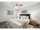 Cozy bedroom with a comfortable bed, stylish decor, and natural light from two windows at 2353 Eastwood Dr, Clearwater, FL 33765