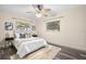 Comfortable bedroom with a ceiling fan, a neutral color palette, and stylish decor for a relaxing atmosphere at 2353 Eastwood Dr, Clearwater, FL 33765