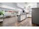 Open kitchen with stainless steel appliances, breakfast bar and view of the living area at 2353 Eastwood Dr, Clearwater, FL 33765
