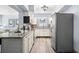 Bright kitchen featuring stainless steel appliances, mosaic tile backsplash, and ample counter space at 2353 Eastwood Dr, Clearwater, FL 33765