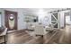 Elegant living room with plenty of seating and light wood-look flooring throughout at 2353 Eastwood Dr, Clearwater, FL 33765