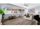 Bright living room featuring large windows, modern decor, and stylish furnishings at 2353 Eastwood Dr, Clearwater, FL 33765
