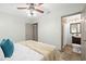 Comfortable bedroom with an ensuite bathroom featuring a vanity and a tiled shower at 2353 Eastwood Dr, Clearwater, FL 33765