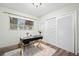 A work from home office space with a modern desk and sliding door closet at 2353 Eastwood Dr, Clearwater, FL 33765