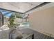 Cozy screened porch with comfortable seating overlooking a pool and garden at 2353 Eastwood Dr, Clearwater, FL 33765