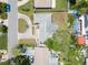 Aerial view of single-story home and the surrounding neighborhood at 2502 Tropical Shores Se Dr, St Petersburg, FL 33705