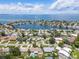 Scenic aerial view showcases waterfront community with lush landscaping and beautiful homes at 2502 Tropical Shores Se Dr, St Petersburg, FL 33705